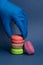 Seller takes macarons in his hand