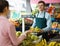 Seller weighing bananas