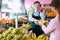 Seller weighing bananas