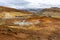 Seltun Geothermal Area in Krysuvik with steaming hot springs, yellow and orange sulphur hills, Iceland