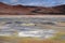 Seltun / Krysuvik KrÃ½suvÃ­k: Road through red hills leading to yellow and white geothermal valley