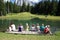 Selva Gardena -Trentino Alto adige - 07/19/2016 Group of people sitting on a pier viewed from behind