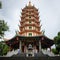 Semarang, Indonesia - December 3, 2017 : View of Pagoda Avalokitesvara at Vihara Buddhagaya Watugong with a man praying for his