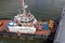 Sembawang, Singapore - FEB 27 2013: close up view of PSA Marine tugboat Scorpio assisting arriving ship