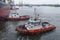 Sembawang, Singapore - March 10 2013: Tugboats assisting crude oil tanker in manoeuvring alongside at Sembawang shipyard