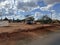 Semi arid vegetation with shops along Nairobi Mombasa highway Kenya, Africa