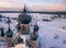 Semi-destroyed dome crosses of the abandoned church in the Yaroslav region in winter, Russia