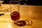 Semi empty beer cup on pub wood table