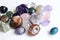 Semi-precious stones of different colors. Amethyst and amethyst druse crystals, rose quartz, agate, apatite, aventurine, olivine,
