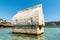 Semi-submerged Lycian sarcophagus tomb by the shore of Kalekoy village of the Demre district in the Antalya, Turkey