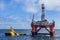 The semi-submersible drilling rig Transocean Leader with anchor handler vessel Balder Viking alongside