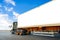 Semi Trailer Truck Driving on The Road. Shipping Container Blank Space For Advertising. Freight Truck Logistic.