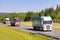 Semi Trailer Trucks Deliver Goods on Freeway