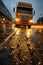 Semi truck driving down a rain soaked road. Transportation in rainy day. Low point of view