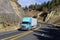 SEMI TRUCK DRIVING ON MOUNTAIN HIGHWAY