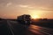 Semi Truck Driving on The Road at Sunset Sky. Industry Road Freight Trucks. Lorry Tractor