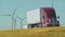 Semi Truck Passes Wind Farm