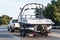 Semi-truck towing a boat on the interstate, California