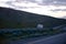 Semi trucks going uphill with light on evening Oregon highway