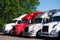 Semi trucks models in row on truck stop parking lot