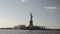 Semi wide shot of Statue of Liberty filmed in the sunset from the river in New York, United States of America