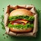 Semi-wrapped burger against green background