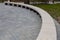 semicircular wooden bench in the city park