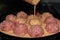 Semifinished. Frozen Meatballs. Preparation for cooking. Selective focus