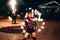 SEMIGORYE, IVANOVO OBLAST, RUSSIA - JUNE 26, 2018: Fire show. Girls dancers spin torches of fire.