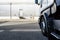 A semitrailer truck parked opposite an industrial building