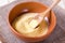 Semolina in a bowl with a wooden spatula