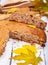 Semolina cake or manna pie with walnuts and raisins on wooden rustic table.