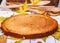 Semolina cake or manna pie with walnuts and raisins on wooden rustic table.