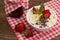 Semolina with grated chocolate and strawberry on a fabulously delicious tomorrow. Wooden background. Top view. Close-up