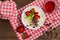 Semolina with grated chocolate and strawberry on a fabulously delicious tomorrow. Wooden background. Top view. Close-up