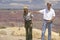 Senator John Kerry speaking with ranger at rim of Bright Angel Lookout, Grand Canyon, AZ