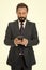 Sending important message. Businessman formal suit holds smartphone. Man bearded businessman concentrated on texting