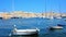 SENGLEA, MALTA - JUNE 19, 2018: Small boats and luxury yachts in Vittoriosa marina with a view on Birgu on background, on June 19