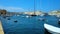 SENGLEA, MALTA - JUNE 19, 2018: The stone shore of medieval Senglea is perfect viewpoint, overlooking Vittoriosa marina and mediev