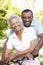 Senior African American Couple Cycling In Park