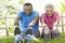 Senior African American Couple Exercising In Park