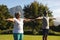 Senior african american couple practicing yoga in stunning countryside retreat