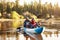 Senior African American Couple Rowing Kayak On Lake