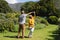 Senior african american couple spending time in sunny garden together dancing