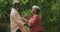 A senior african american couple spending time together dancing in the garden social distancing in q
