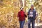 Senior African American Couple Walking Through Fall Woodland