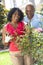 Senior African American Man Woman Couple Gardening