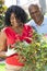 Senior African American Man Woman Couple Gardening