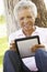 Senior African American Woman In Park Using Tablet Computer