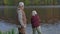 Senior angler fishing with his grandson on local lake